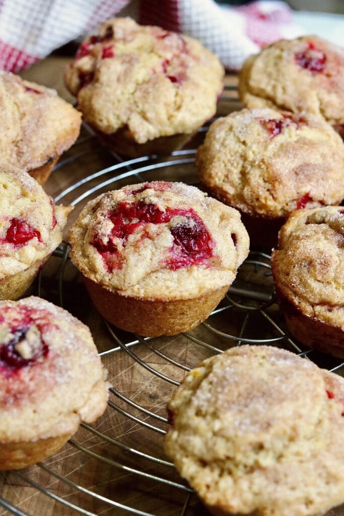 cranberry muffins cooling on a wire rack 
