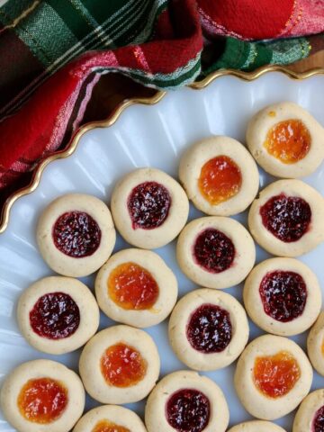 overhead view of thumbprint cookies on a holiday plate