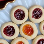 vegan thumbprint cookies on a Christmas plate