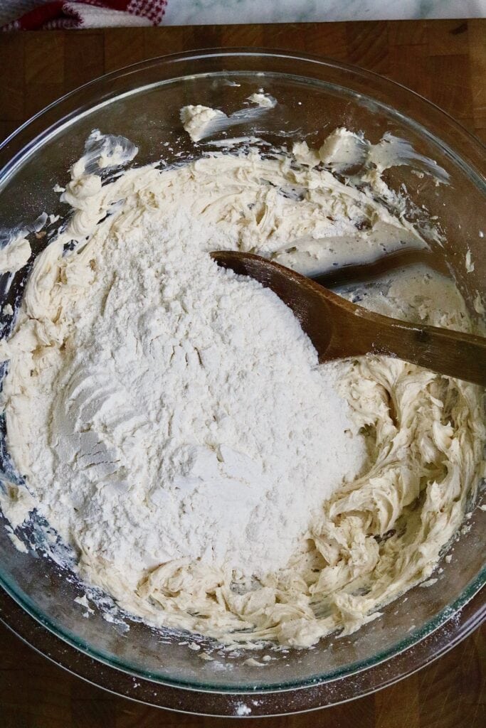 thumbprint cookie dough ingredients being mixed together in a bowl
