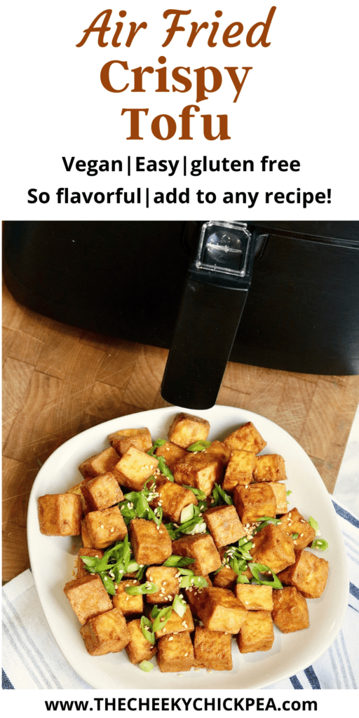 a plate of crispy air fried tofu beside an air fryer