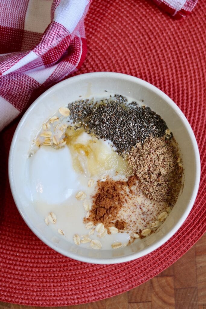 ingredients for overnight oats in a bowl ready to be mixed