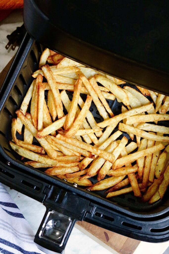 crispy cooked French fries in an air fryer basket