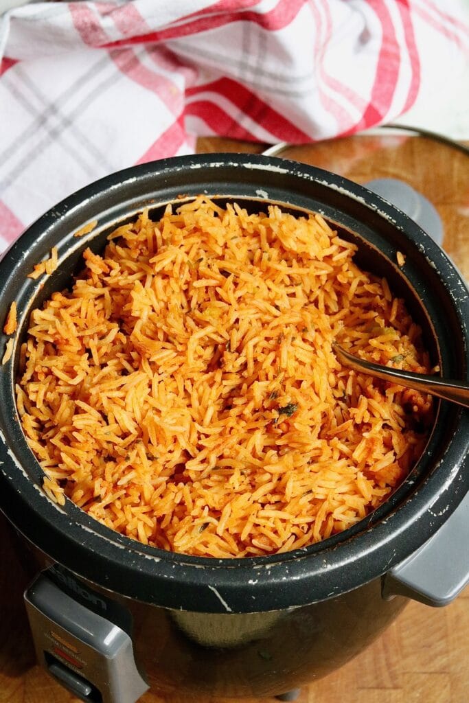 Mexican Rice cooked in a rice cooker fluffed with a fork