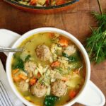 vegan Italian wedding soup in a bowl with a spoon