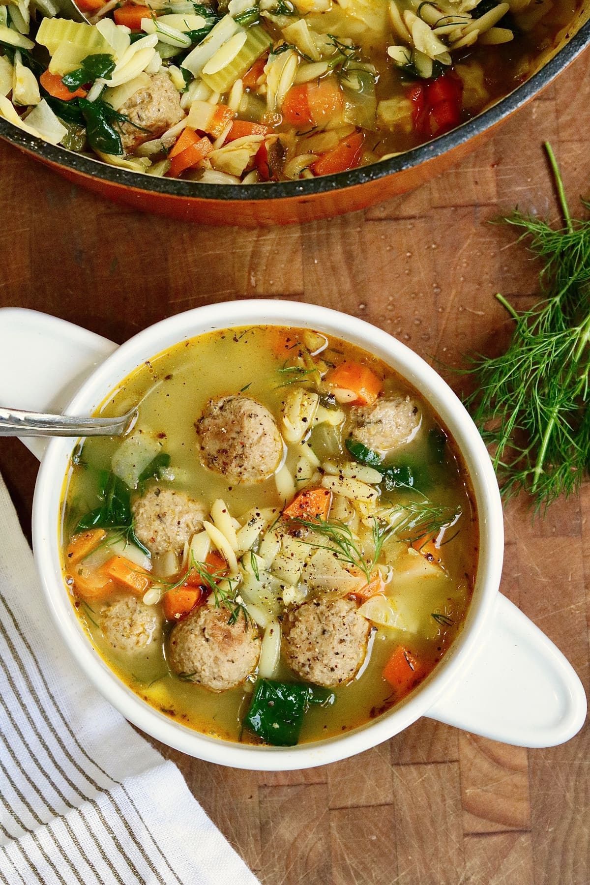 vegan Italian wedding soup in a bowl with a spoon