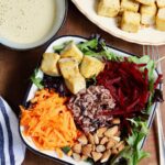 glory bowl in a salad bowl with tahini dressing on the side