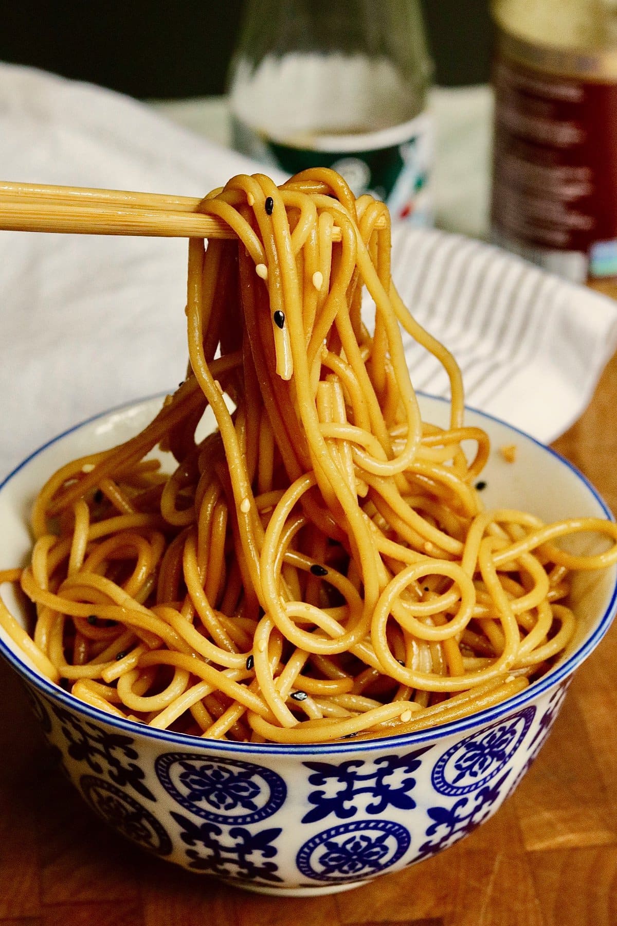 hibachi noodles in a bowl with chopsticks