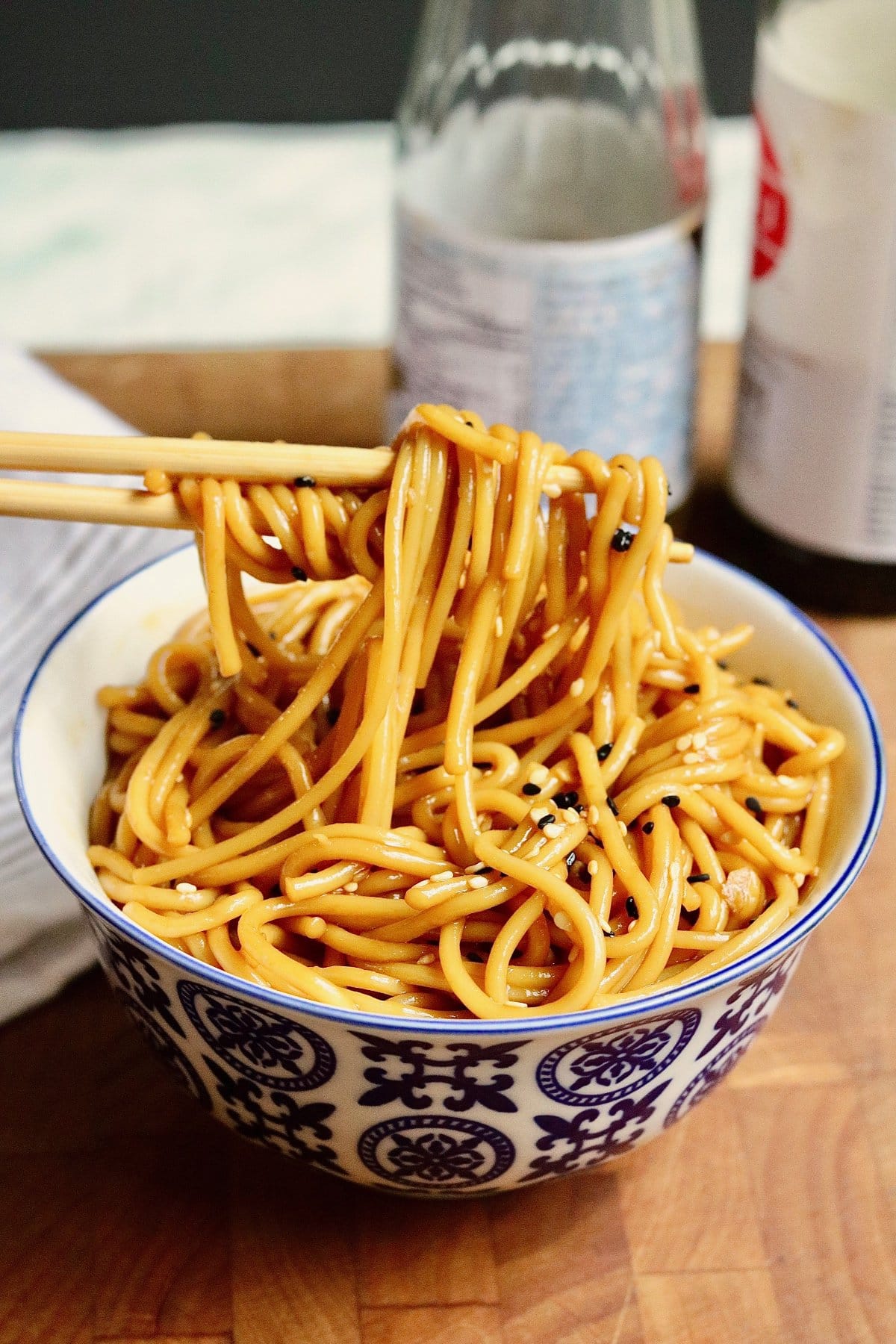 hibachi noodles being eaten with chopsticks