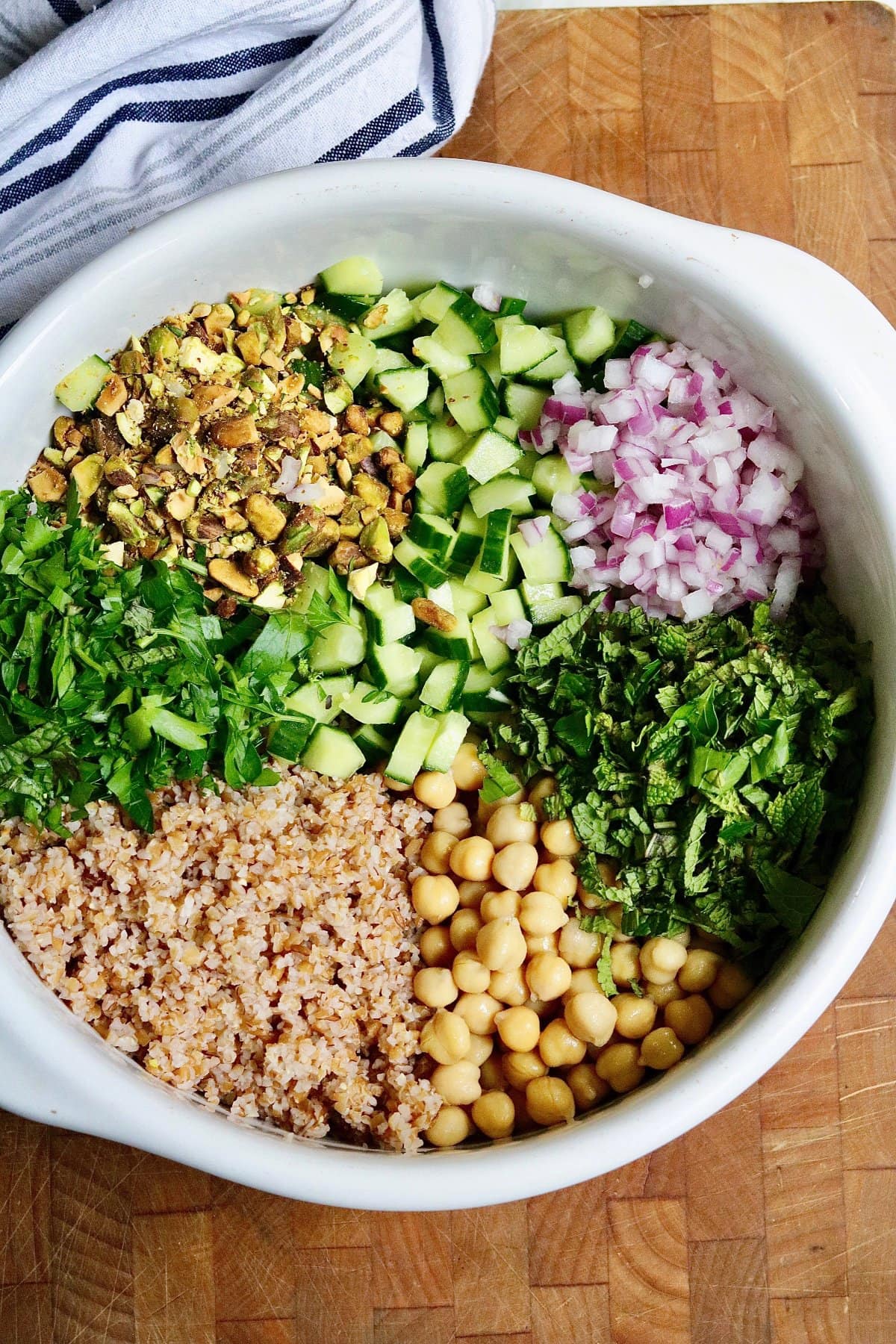 ingredients for Jennifer Aniston bulgur salad chopped in a bowl