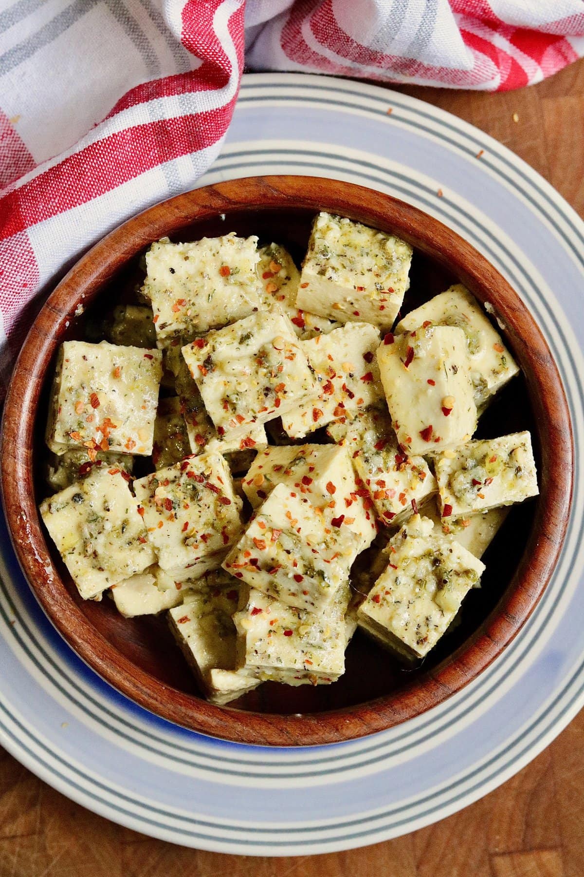 cubes of greek marinated tofu in a bowl for vegan feta cheese