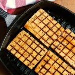 tofu steaks marinated and grilled in a grill pan