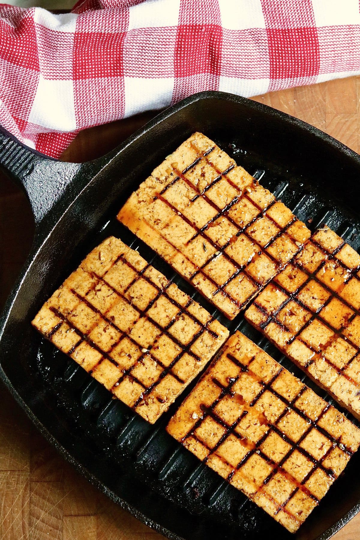 tofu steaks marinated and grilled in a grill pan