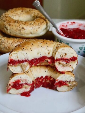 strawberry rhubarb jam slathered on a bagel with peanut butter