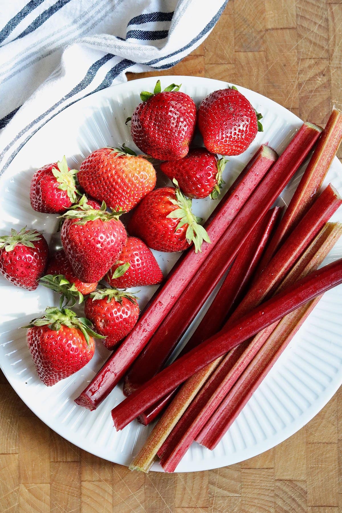 fresh strawberries and rhubarb on a plate