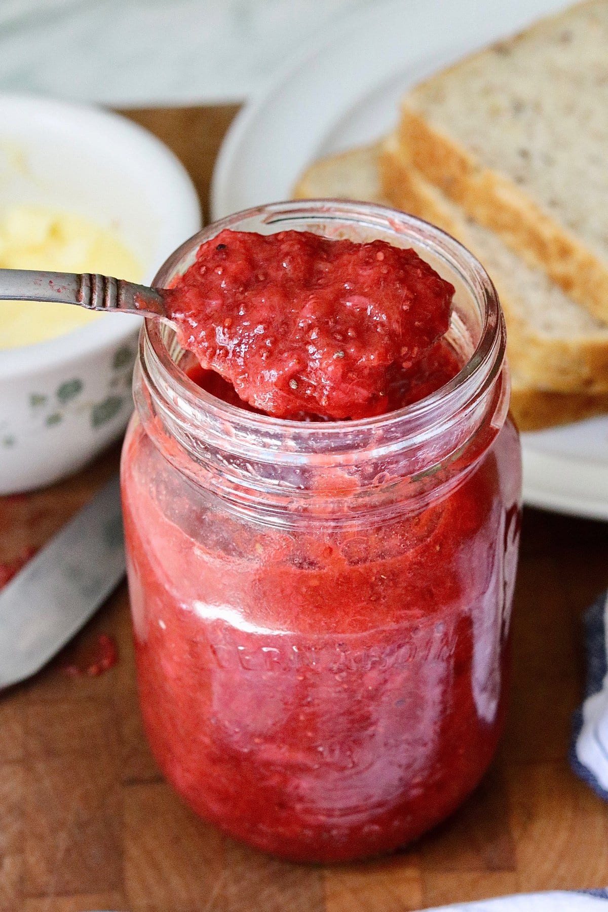 strawberry rhubarb chia seed jam in a canning jar ready for the fridge