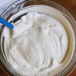 vegan whipped cream ready to serve in a mixing bowl