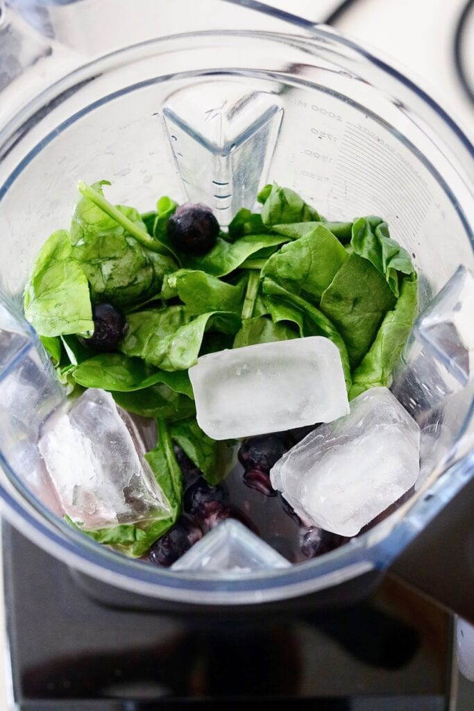 ingredients for blueberry banana smoothie in a blender 