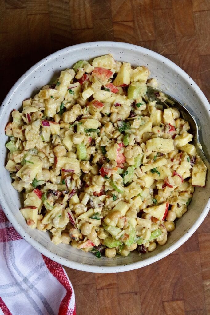 curried chickpea salad mixed in a serving bowl