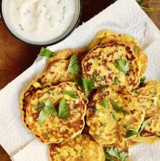 vegan corn fritters on a plate with garlic aioli