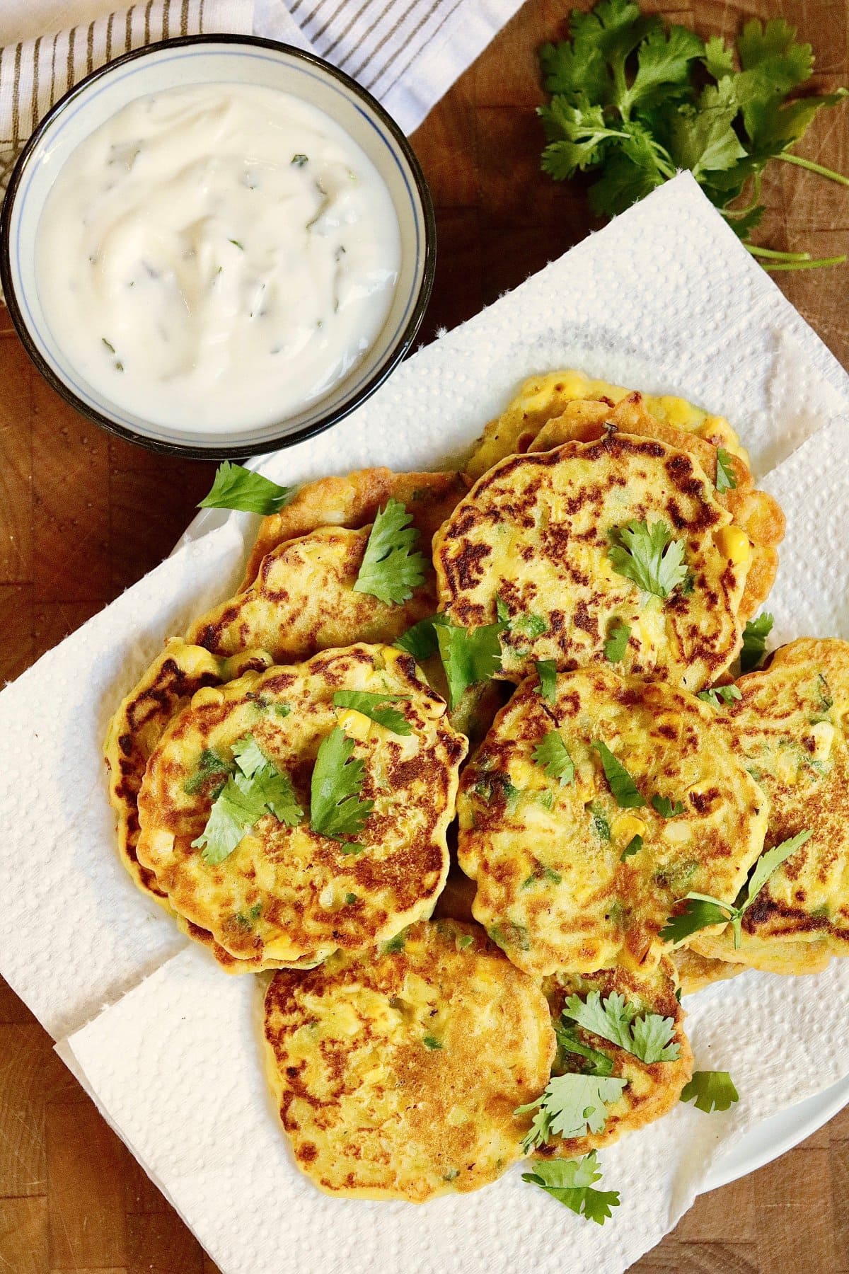 vegan corn fritters on a plate with garlic aioli