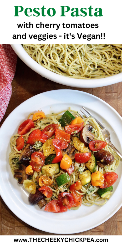 pesto pasta topped with cherry tomatoes and roasted veggies