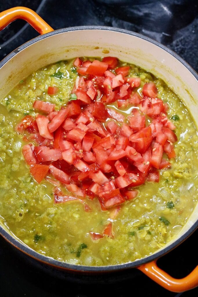 ingredients for red lentil Dahl simmering in a pot