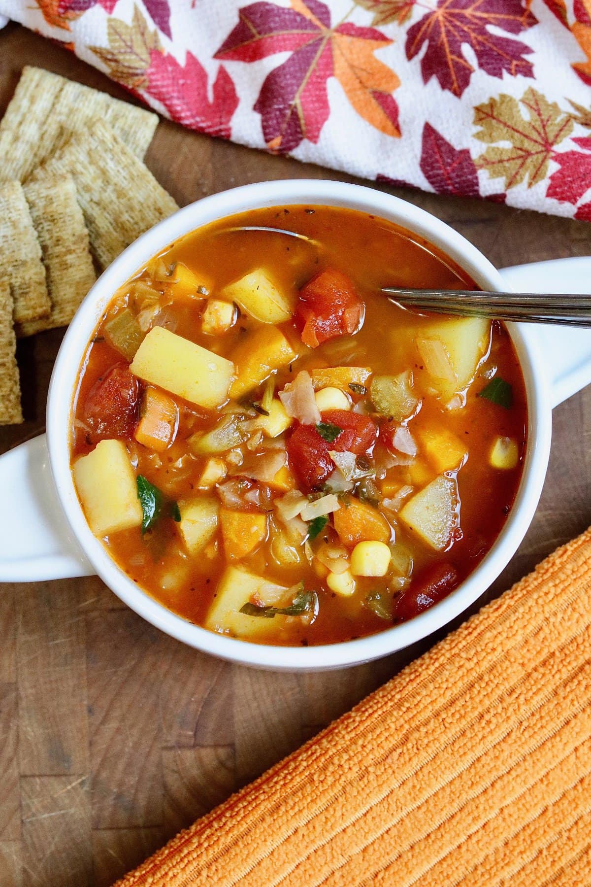 instant pot vegetable soup in a white bowl with a spoon