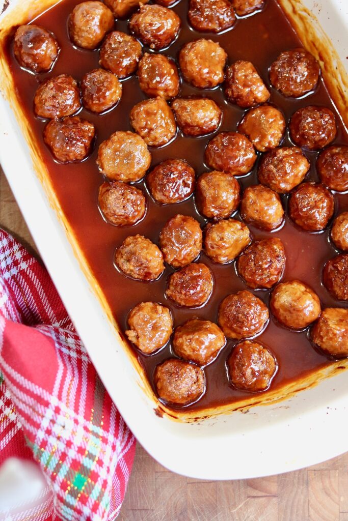 vegan grape jelly cocktail meatballs baked in a casserole dish ready to serve