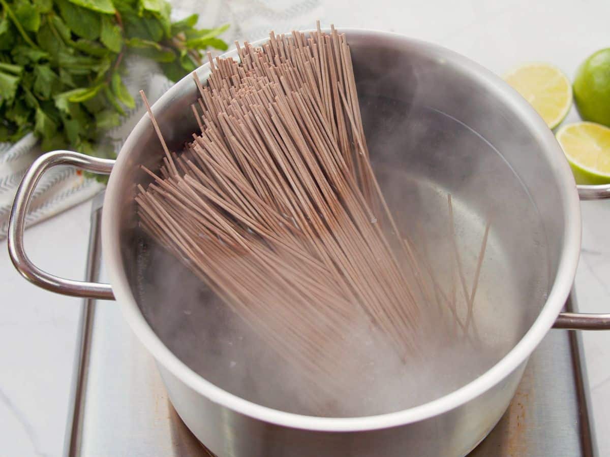 soba noodles in stockpot of water