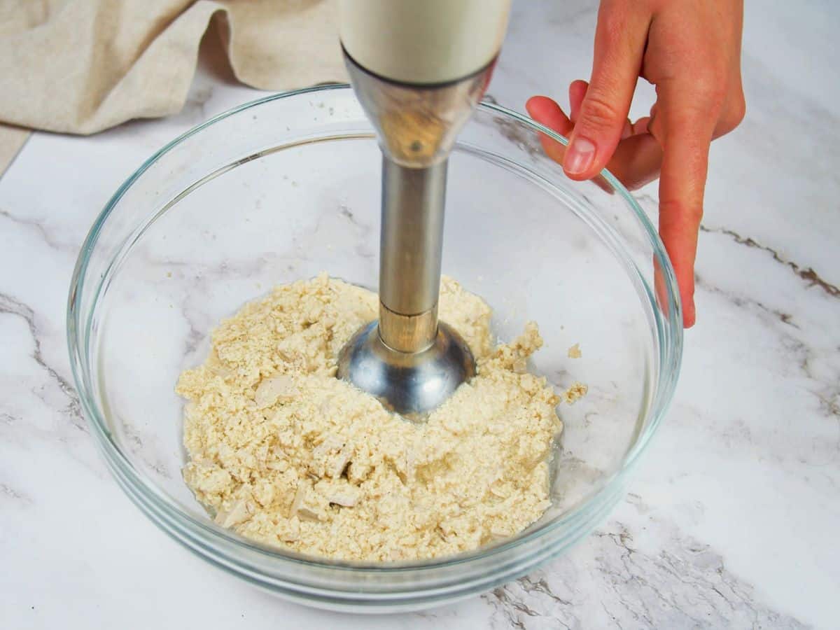 immersion blender in bowl of tofu