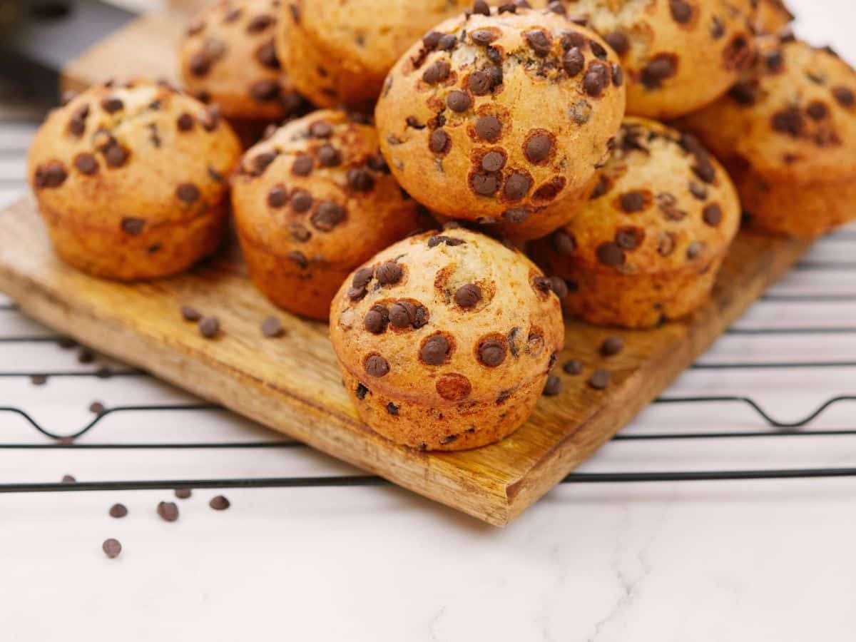 cooling rack underneath plate of chocolate chip muffins