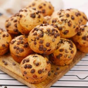 chocolate chip muffins stacked on plate