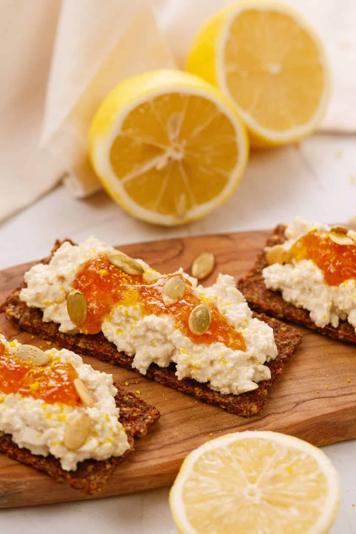 sliced brown bread topped with vegan cottage cheese and jam