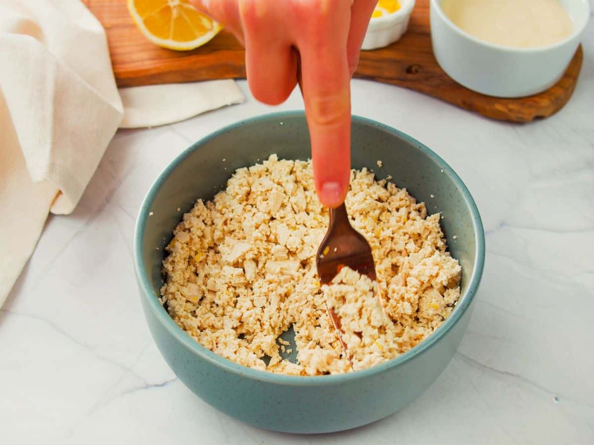 blue bowl of crumbled tofu