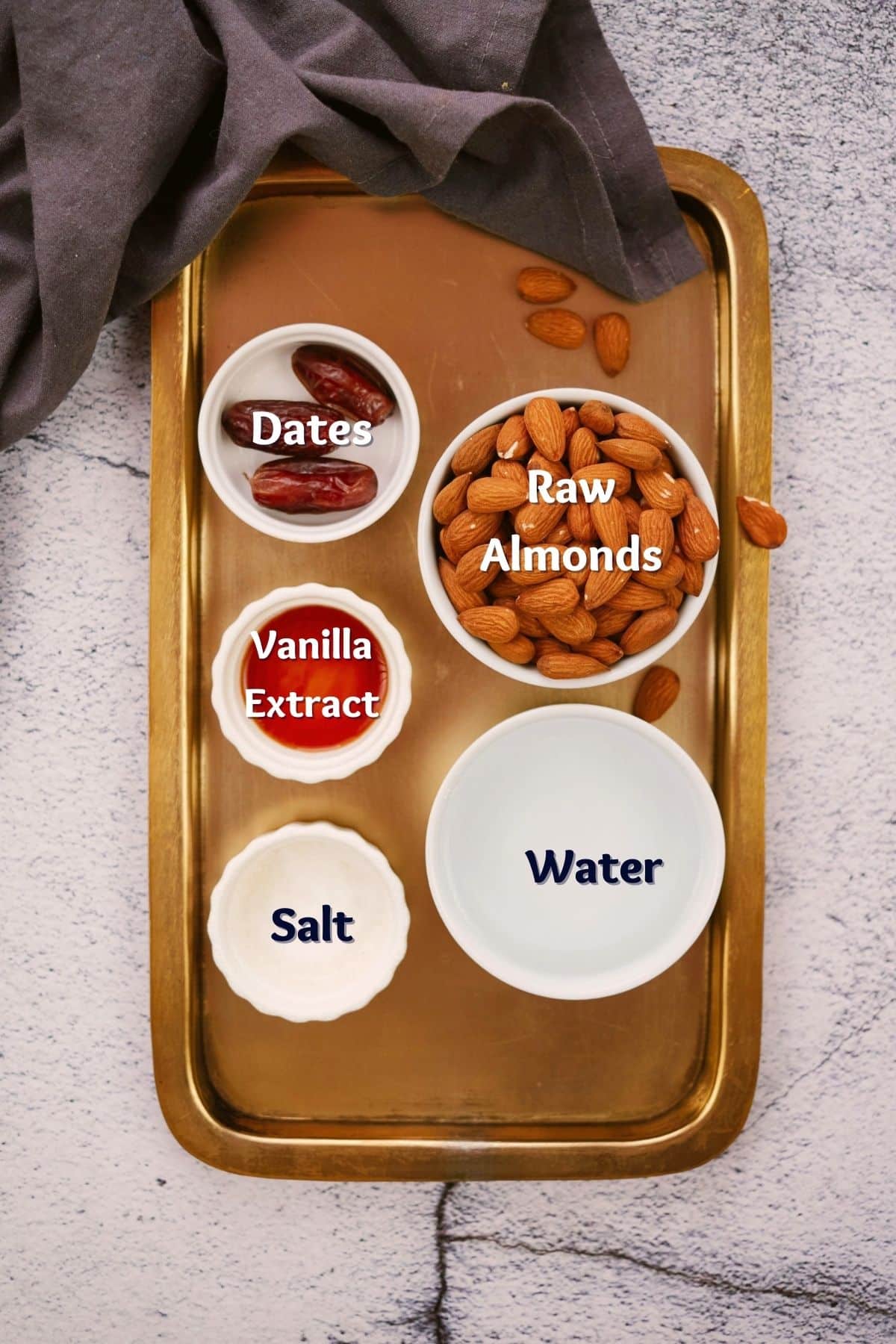 round white ramekins of ingredients for almond milk recipe