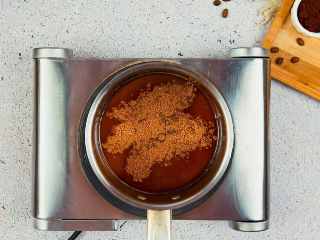sugar and cinnamon in saucepan on hot plate