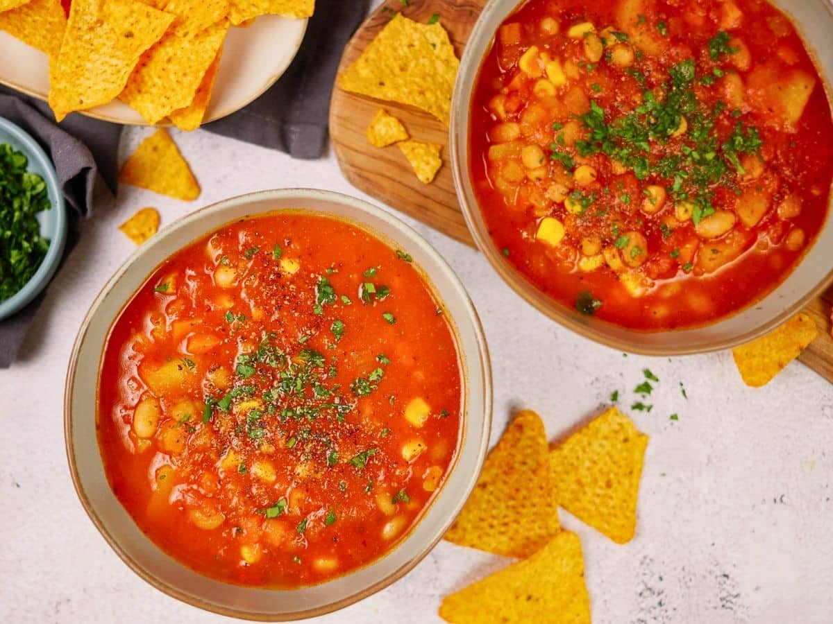 two bowls of soup on table