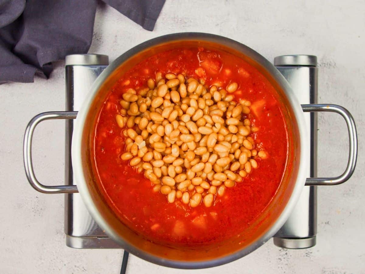 beans on top of stockpot of soup base