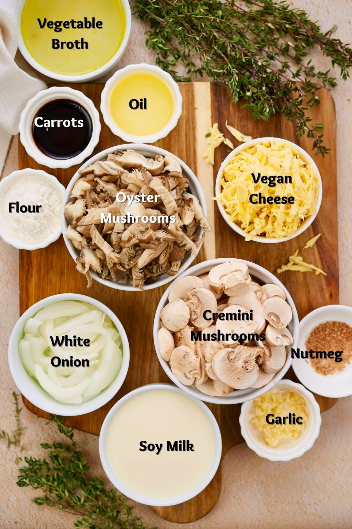 whiter ramekins of ingredients for mushroom stroganoff on wooden cutting board