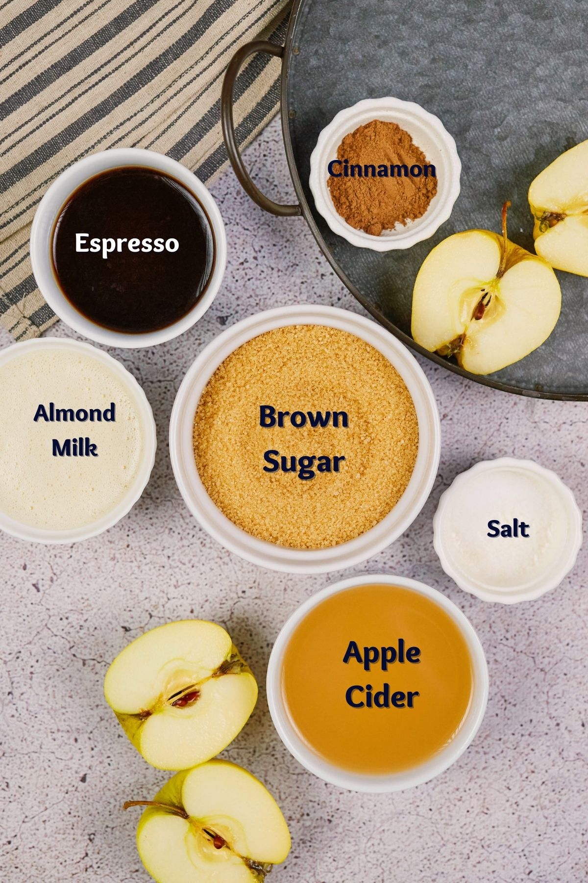 small white ramekins of ingredients on gray table