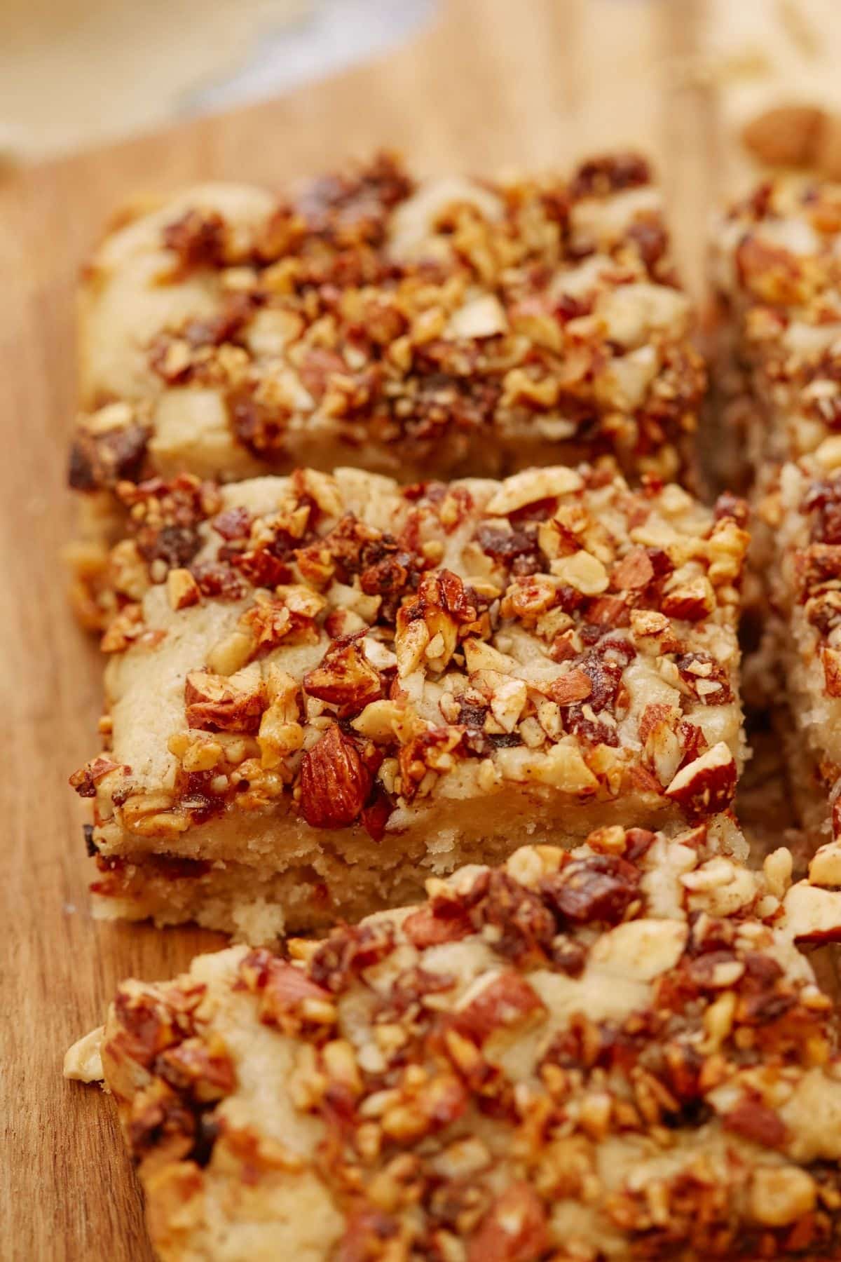 slices of baklava cake topped with nuts