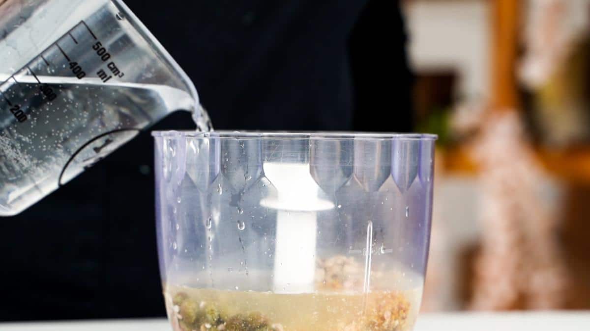 water being poured into food processor