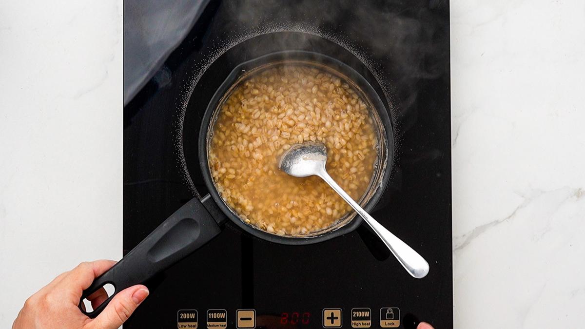 farro cooking in saucepan on hot plate