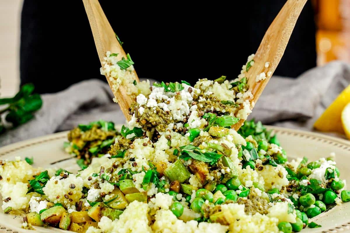 wooden spoons tossing salad