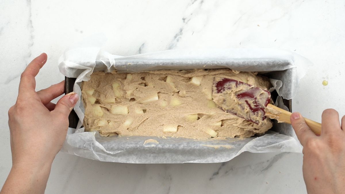 batter for vegan apple pie bread being spread in baking pan