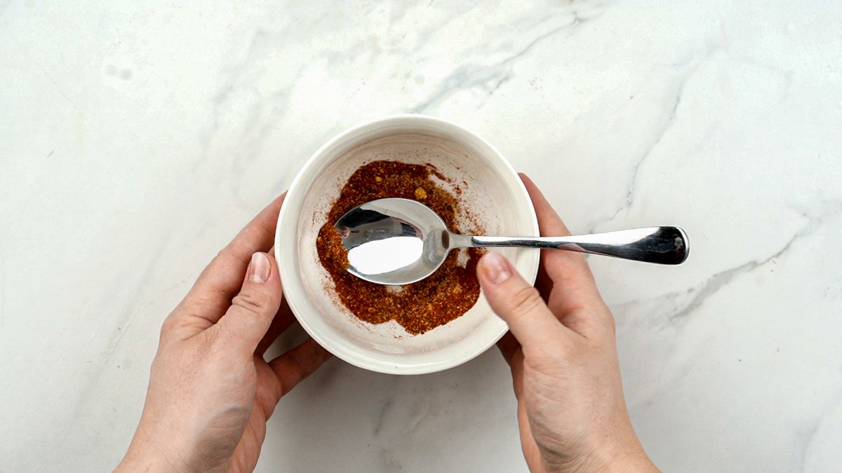 white ramekin of spices with spoon