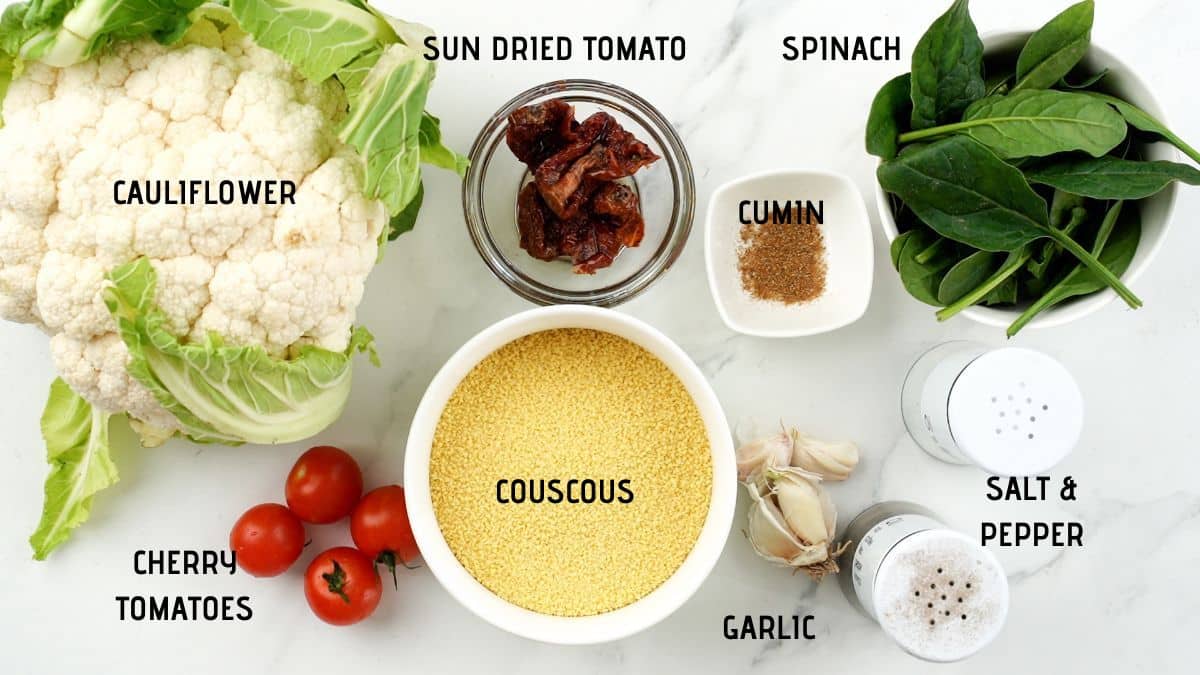 ingredients for a couscous salad on marble table