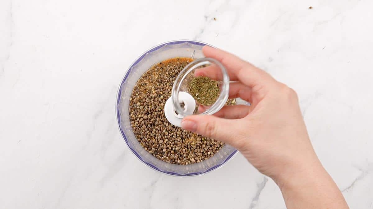 lemon juice being added to food processor