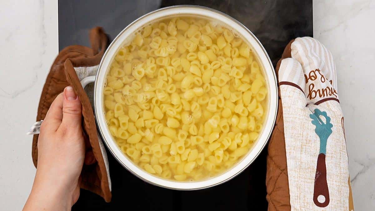 pasta in white stockpot on top of black hot plate